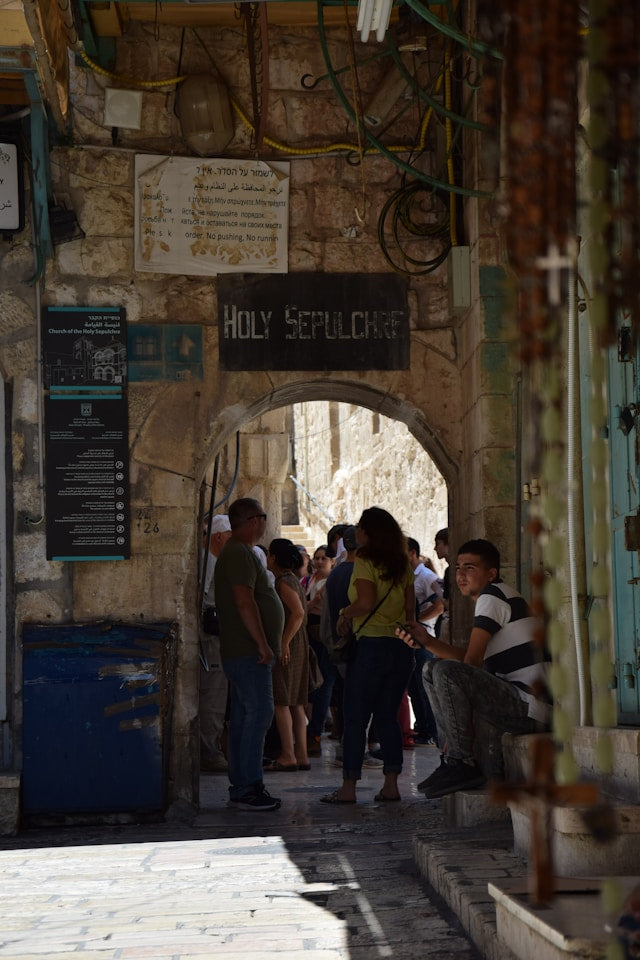 Pilgrims walking through the Old City of Jerusalem near the Church of the Holy Sepulchre